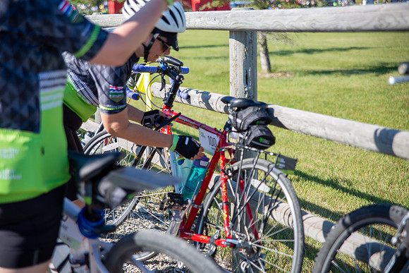 2-BIKE - RIDERS FIXING BIKES-1
